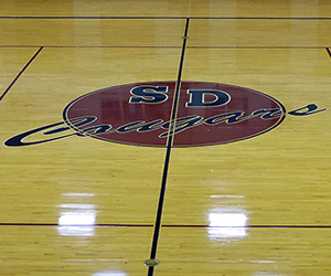 Gym floor with SD Cougars logo