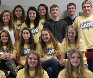 Rows of students wearing SADD t-shirts pose together